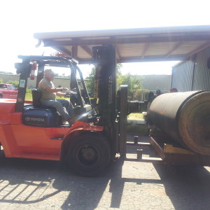 A friends 15,000 lb forklift loading it up.